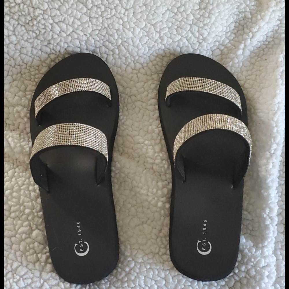 Silver shiny and black slip ons